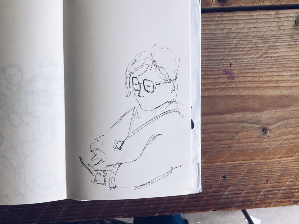 Illustration of someone in the staff room by Nathalie Goss