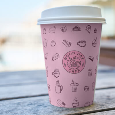 Coffee mug featuring a hand-drawn cake illustration by Nathalie Goss.